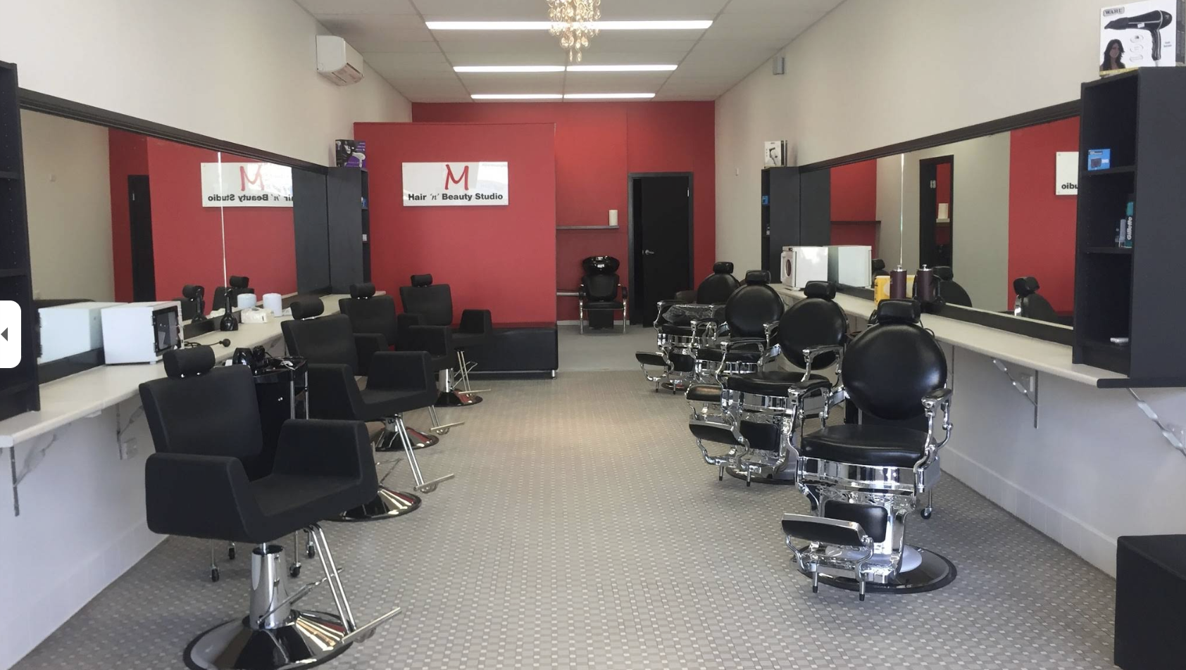 Inside M Hair ’n’ Beauty Studio — barber chairs and styling stations