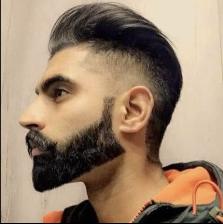 Skin fade with styled top and full beard