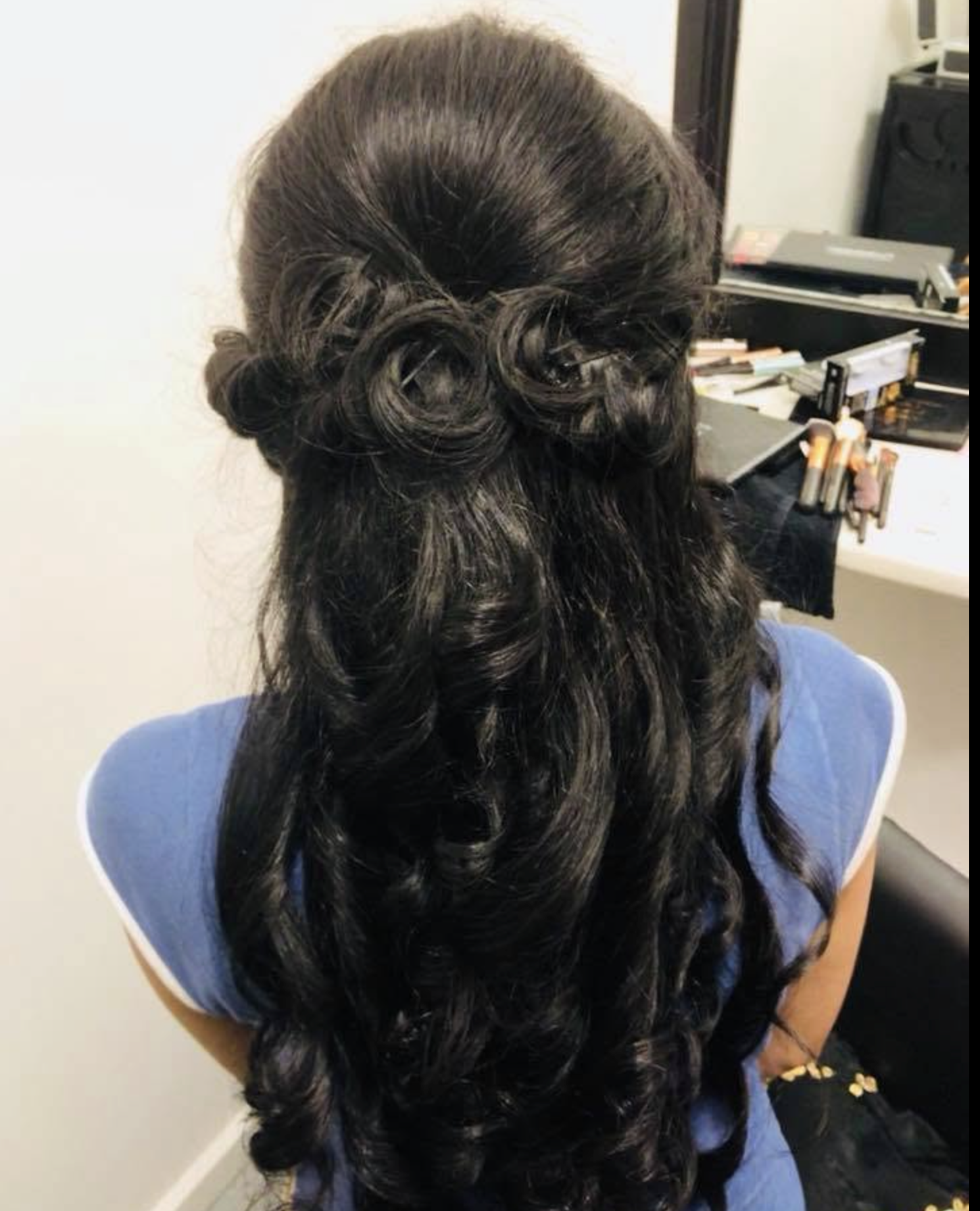 Long curls with rose-twist half-up style